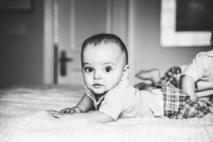 Toronto-Baby-Photography - baby boy lying on bed