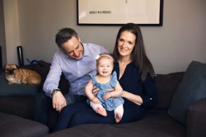 Toronto-Baby-Photography - baby girl posing with parents on couch
