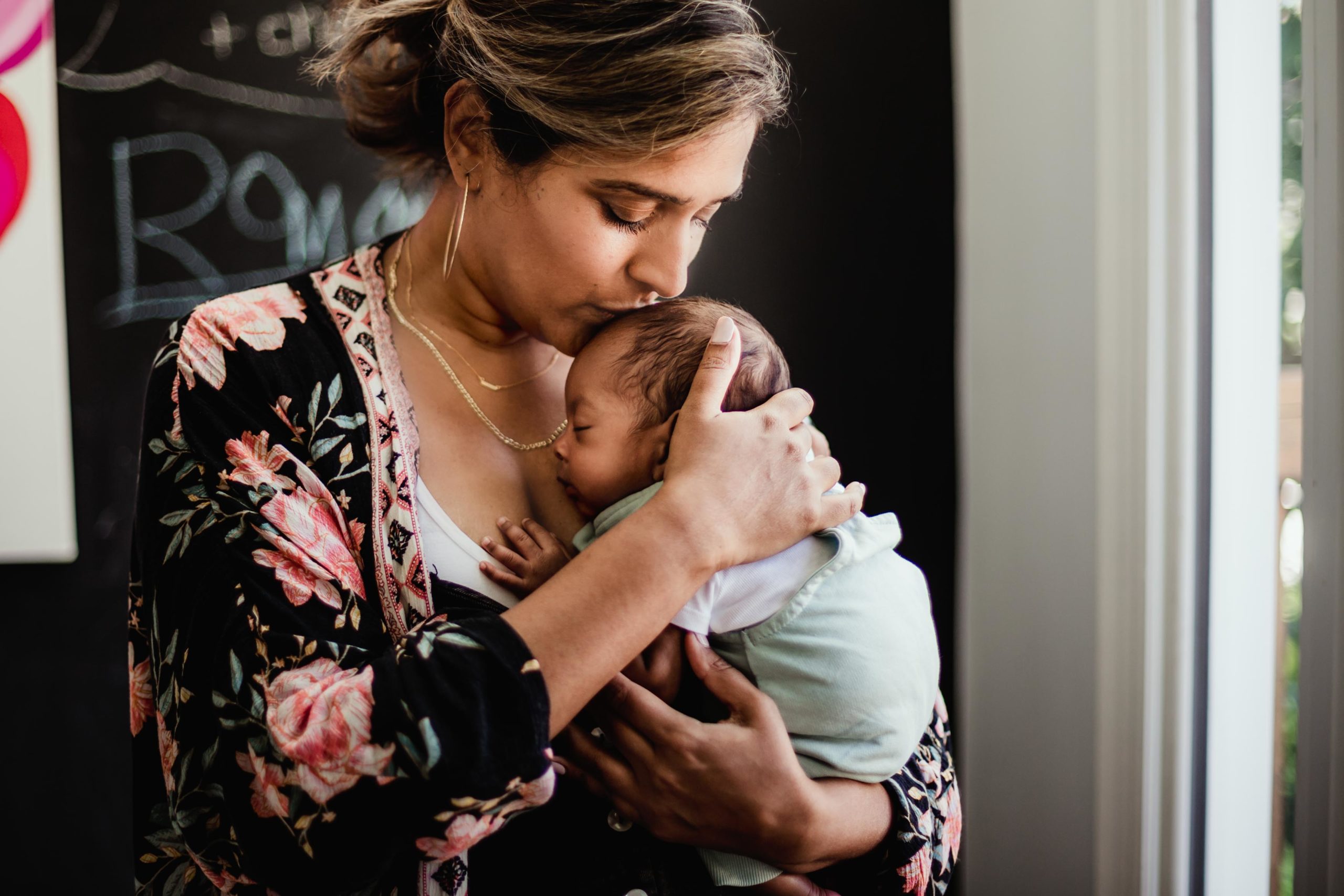 Toronto pelvic floor physiotherapy - mom snuggling newborn baby