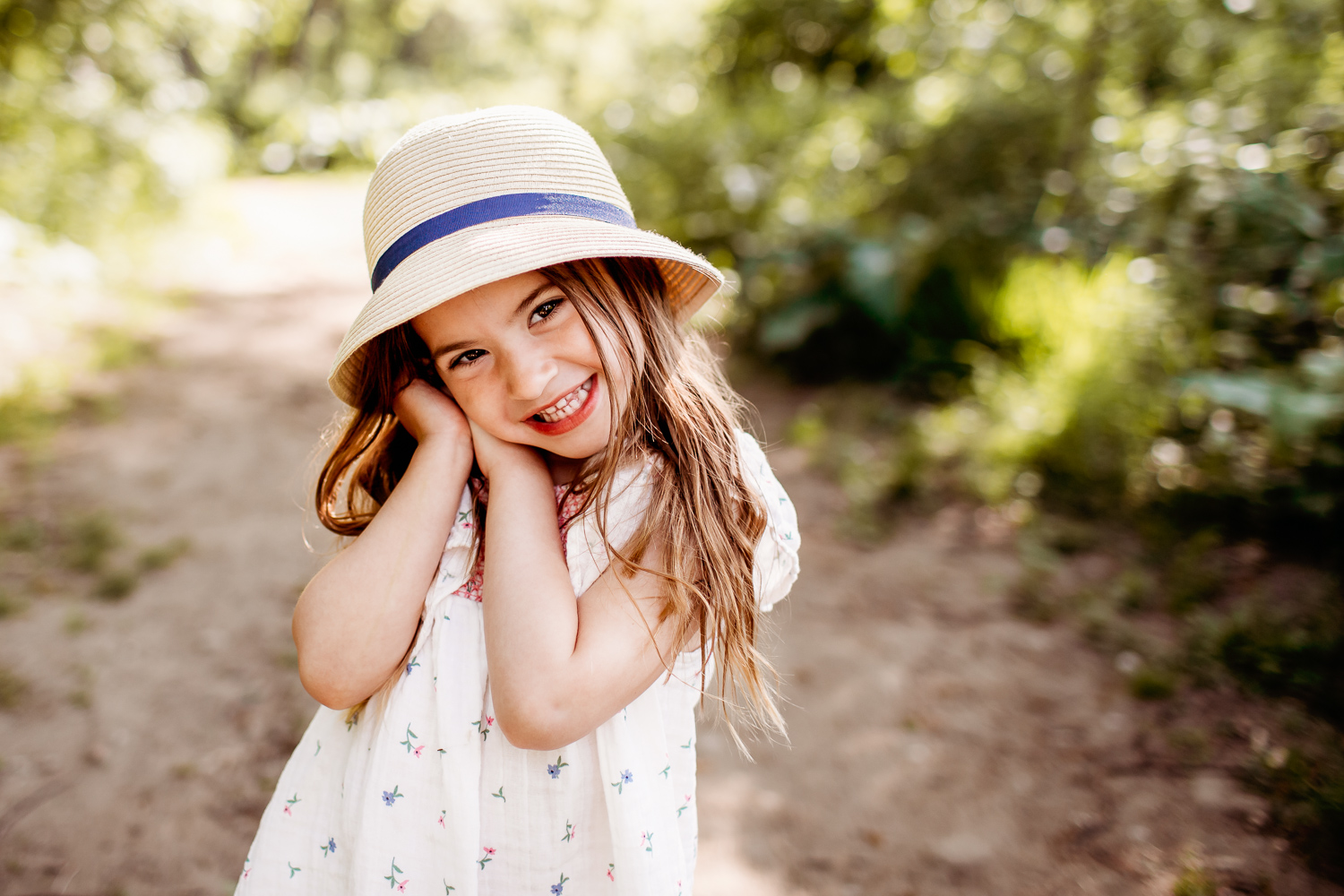 4 year old girl smiling at camera - Toronto Family Photographer