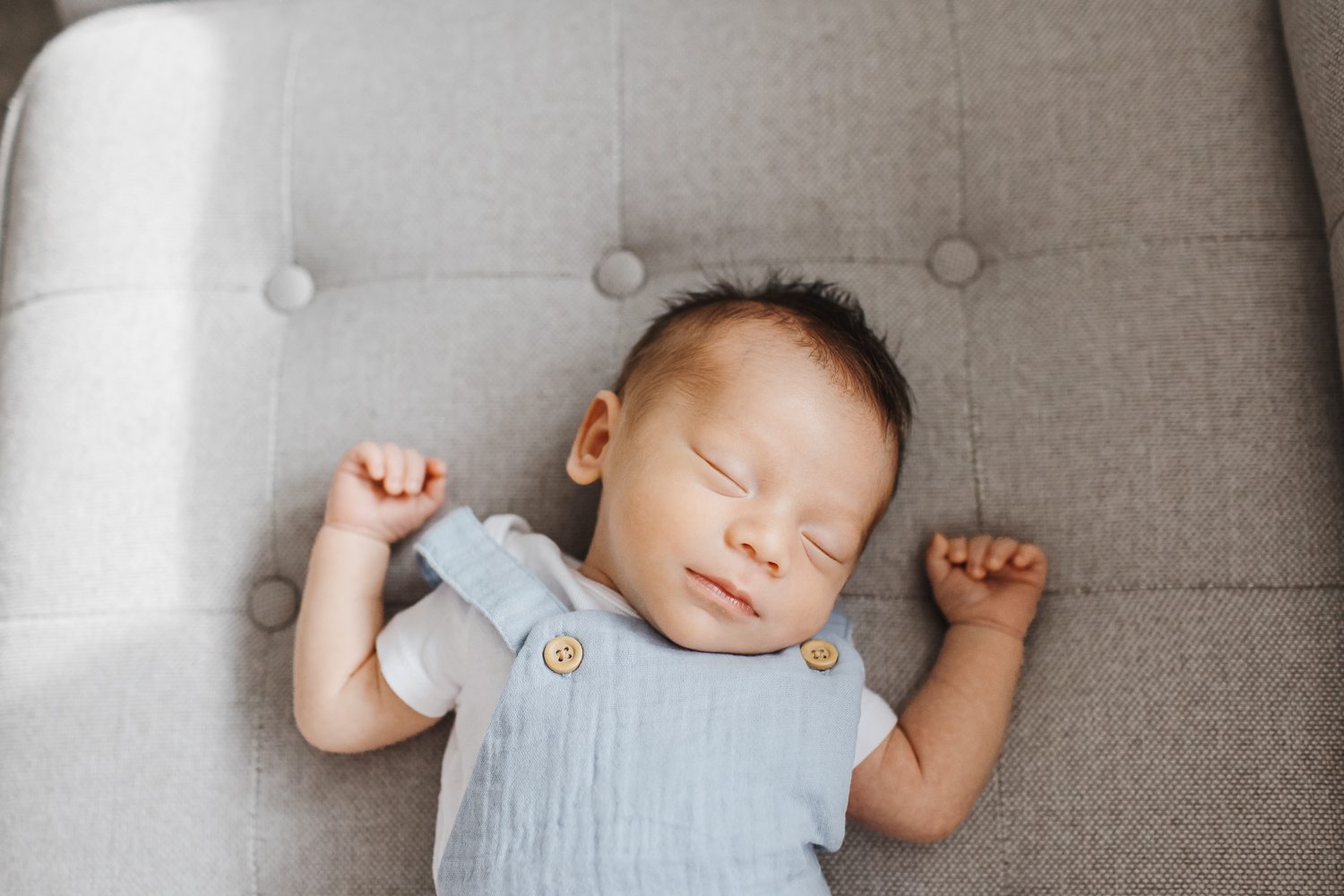 Baby Stores Toronto- Newborn boy sleeping on couch
