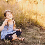 Little girl enjoying a summer popsicle for article on Toronto Swim Schools