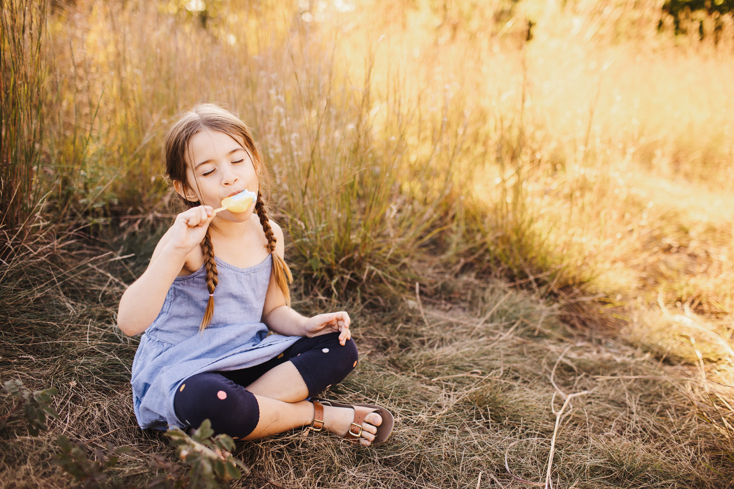 Little girl enjoying a summer popsicle for article on Toronto Swim Schools