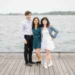 Parents and teen daughter standing on boardwalk at Toronto Harbourfront