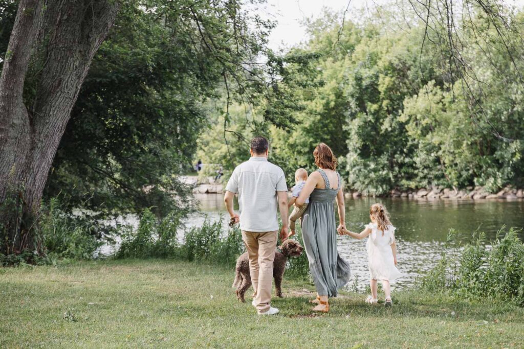 family of 4 exploring Marie Curtis Park during family photos