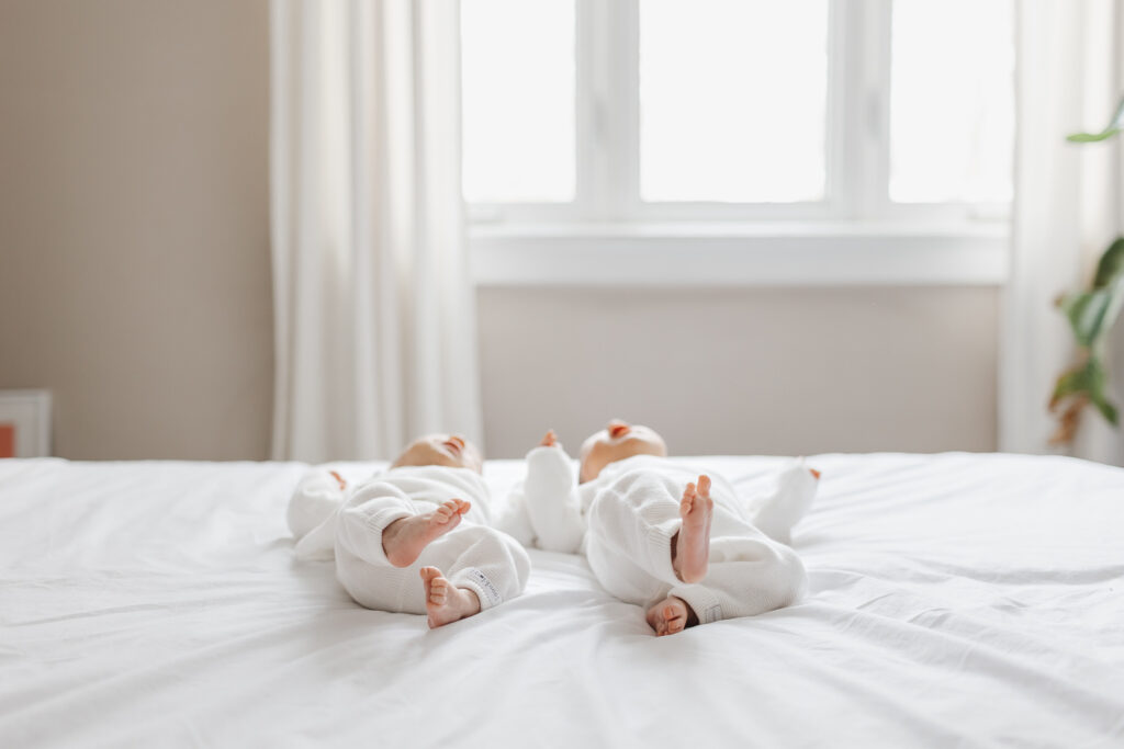 Twin newborn girls captured during relaxed newborn photo session in Toronto home
