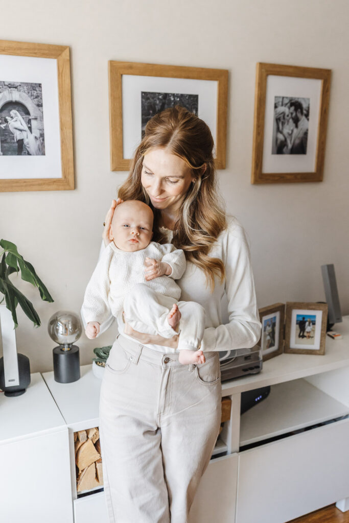 Mom holding older newborn baby boy
